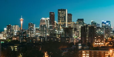 Calgary skyline at night highlighting the city’s real estate market in 2025.