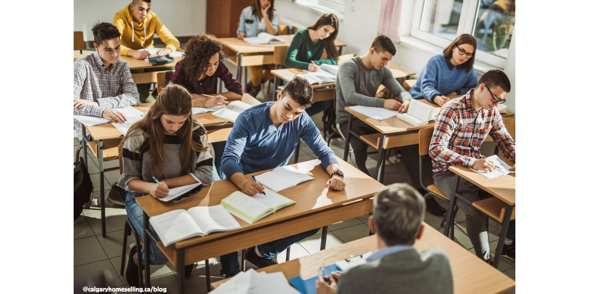 Students studying in a Calgary classroom, highlighting education options for families buying homes.