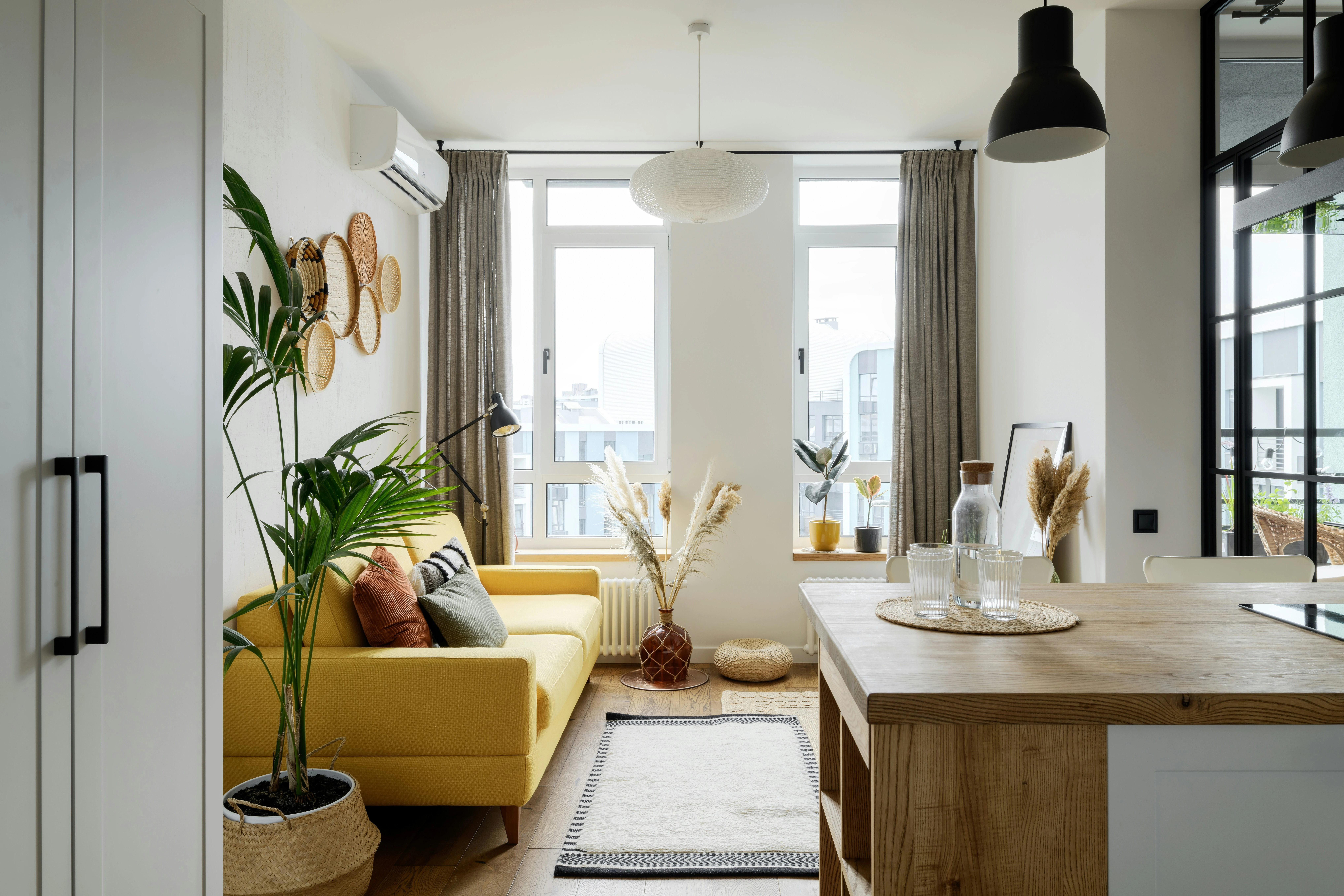 Bright modern living room with natural light, showing home staging that attracts Calgary buyers.