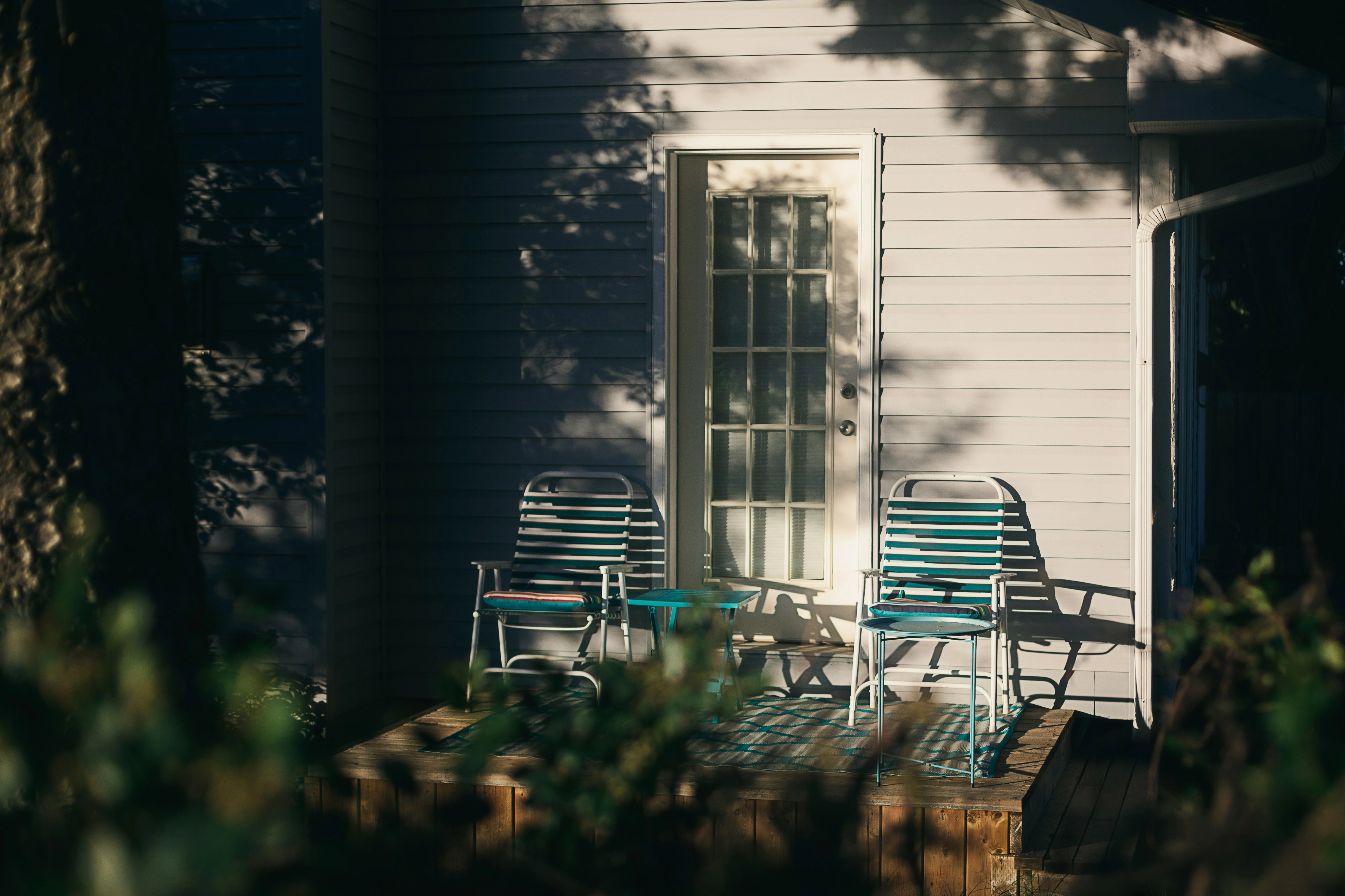Cozy front porch with chairs in a residential Calgary neighbourhood.