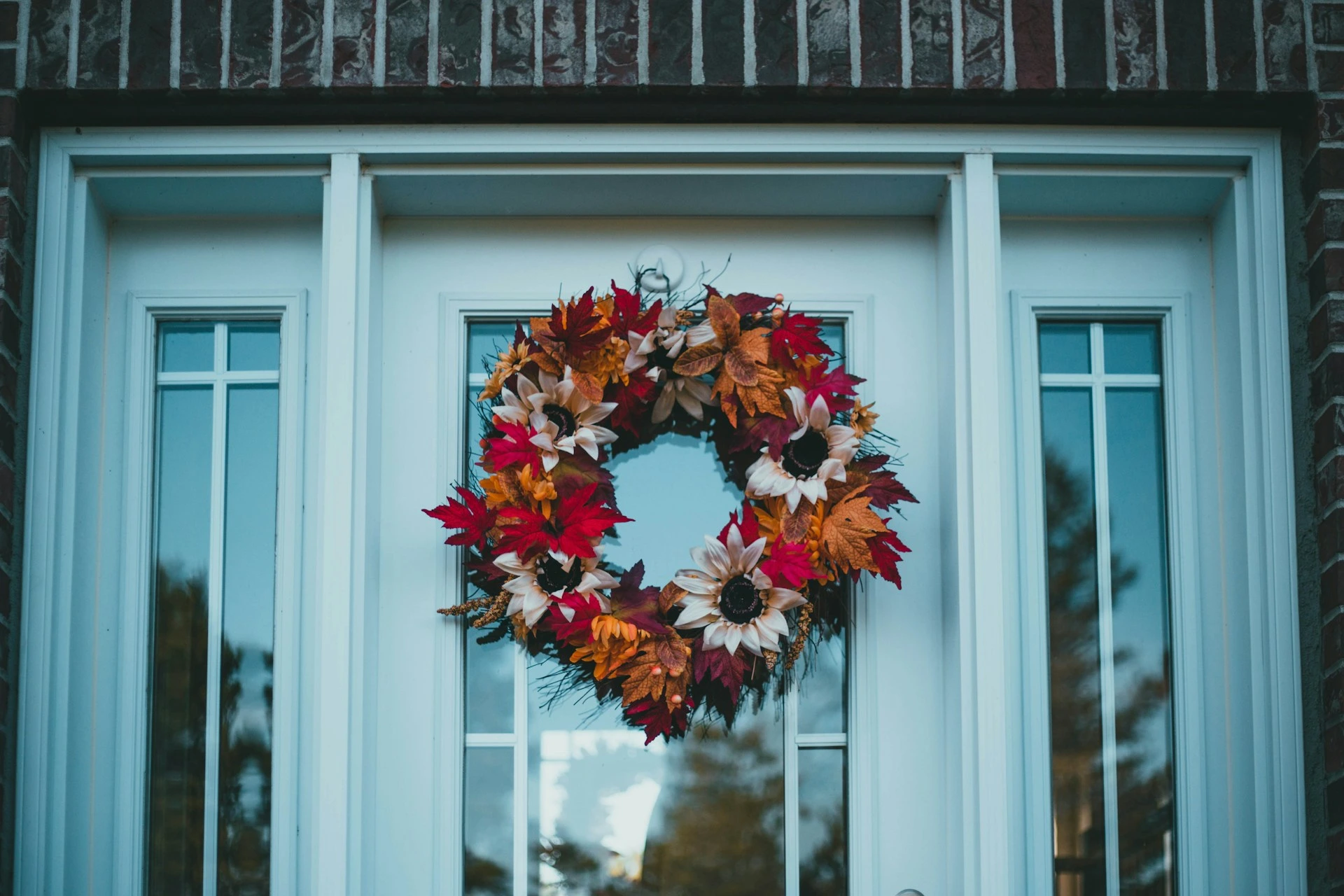 Front door with festive wreath showing winter curb appeal for Calgary home staging.