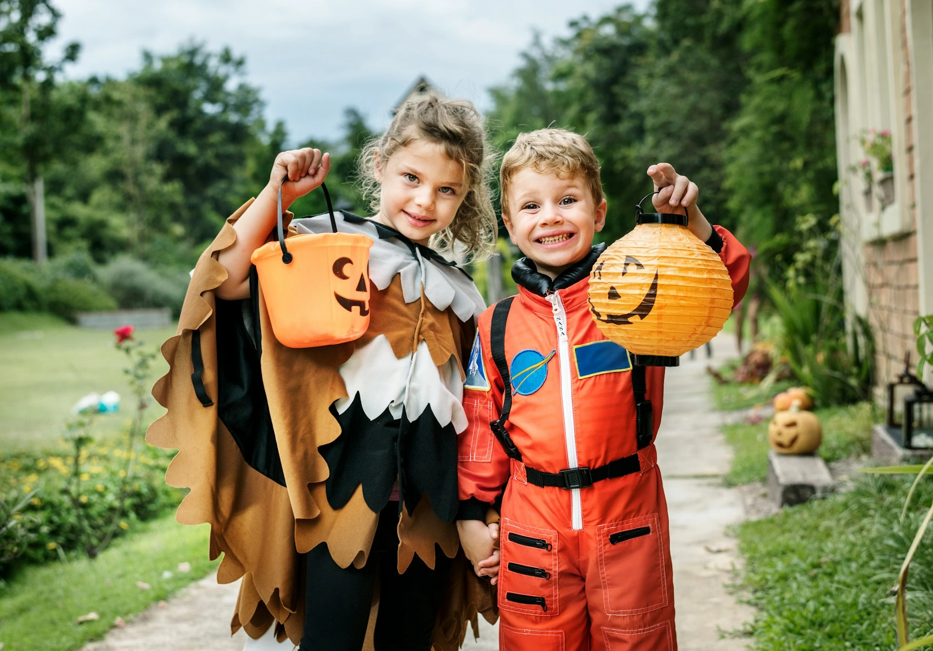 Children in Halloween costumes trick-or-treating safely in a Calgary neighborhood.