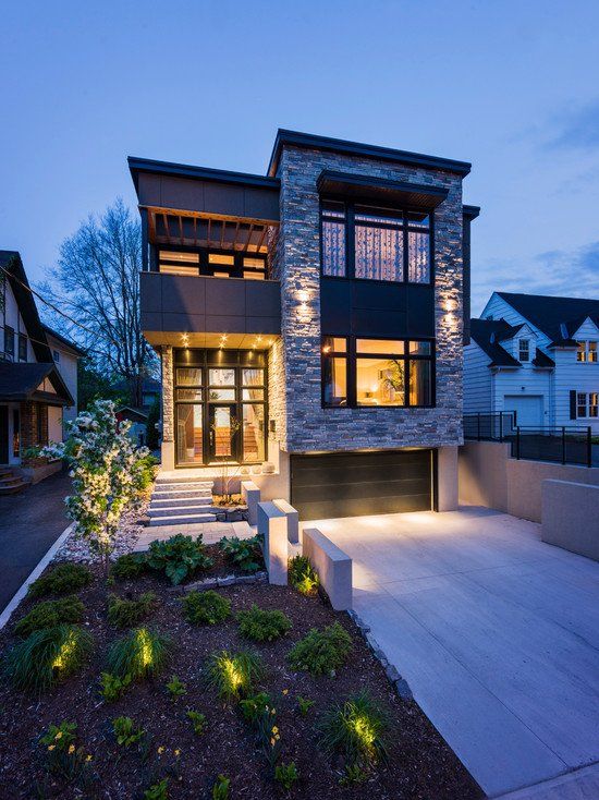 Luxury home exterior at dusk in an upscale Calgary neighbourhood