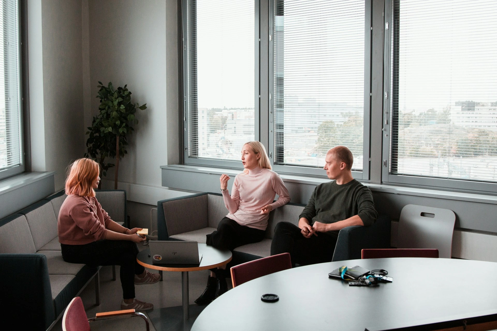Group of clients discussing home selling plans with a Calgary real estate agent.