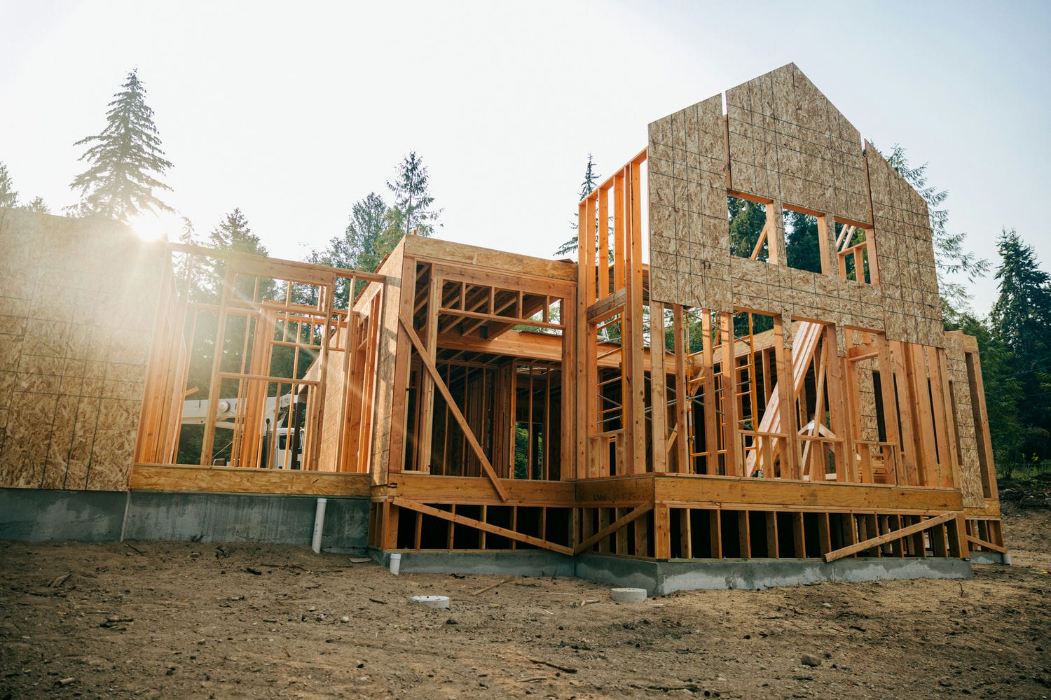 New home under construction with wood framing in Cambrian Heights, Calgary &mdash; infill duplex redevelopment