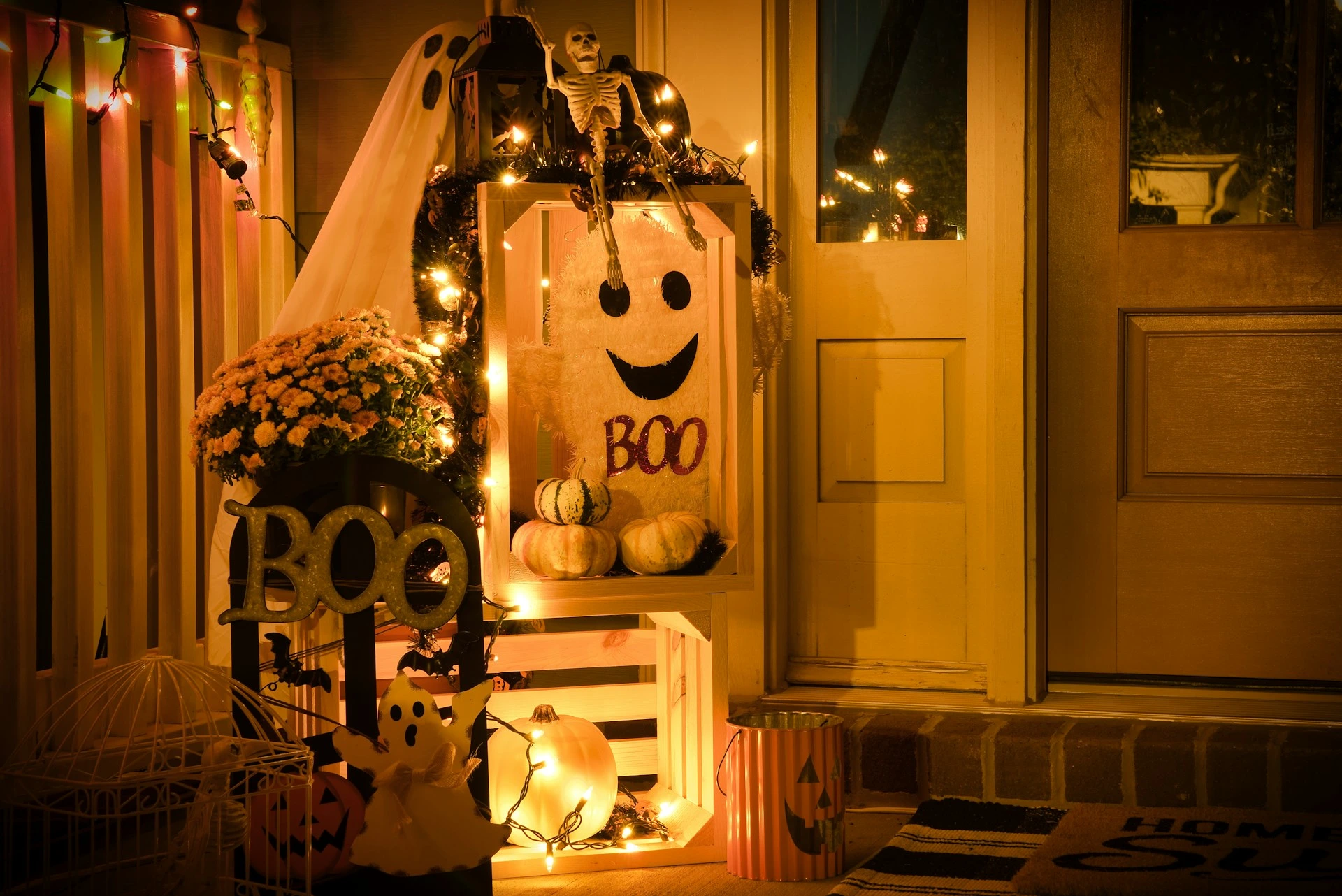Front door decorated with Halloween lights, pumpkins, and safe LED d&eacute;cor in Calgary home.
