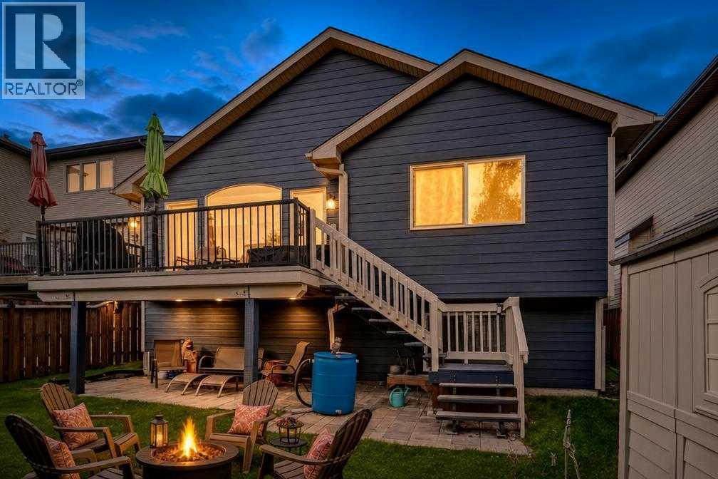 Rear deck and backyard of 226 Cimarron Drive at dusk