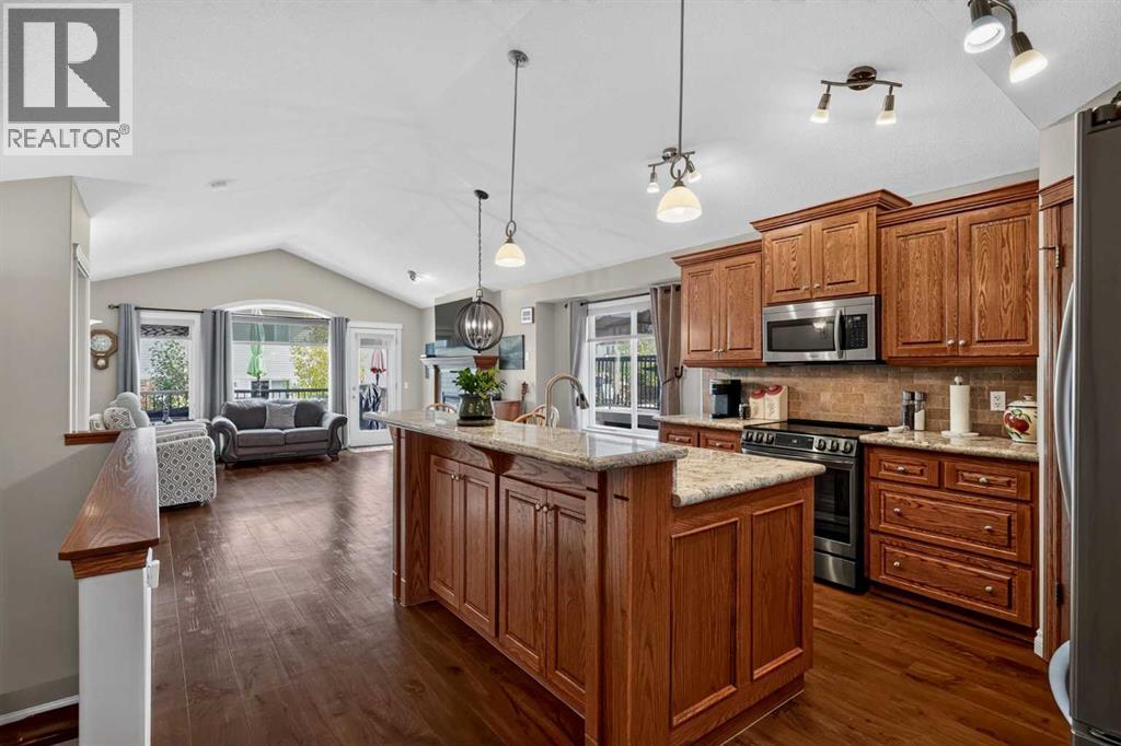 Kitchen with granite countertops, large island and stainless steel appliances