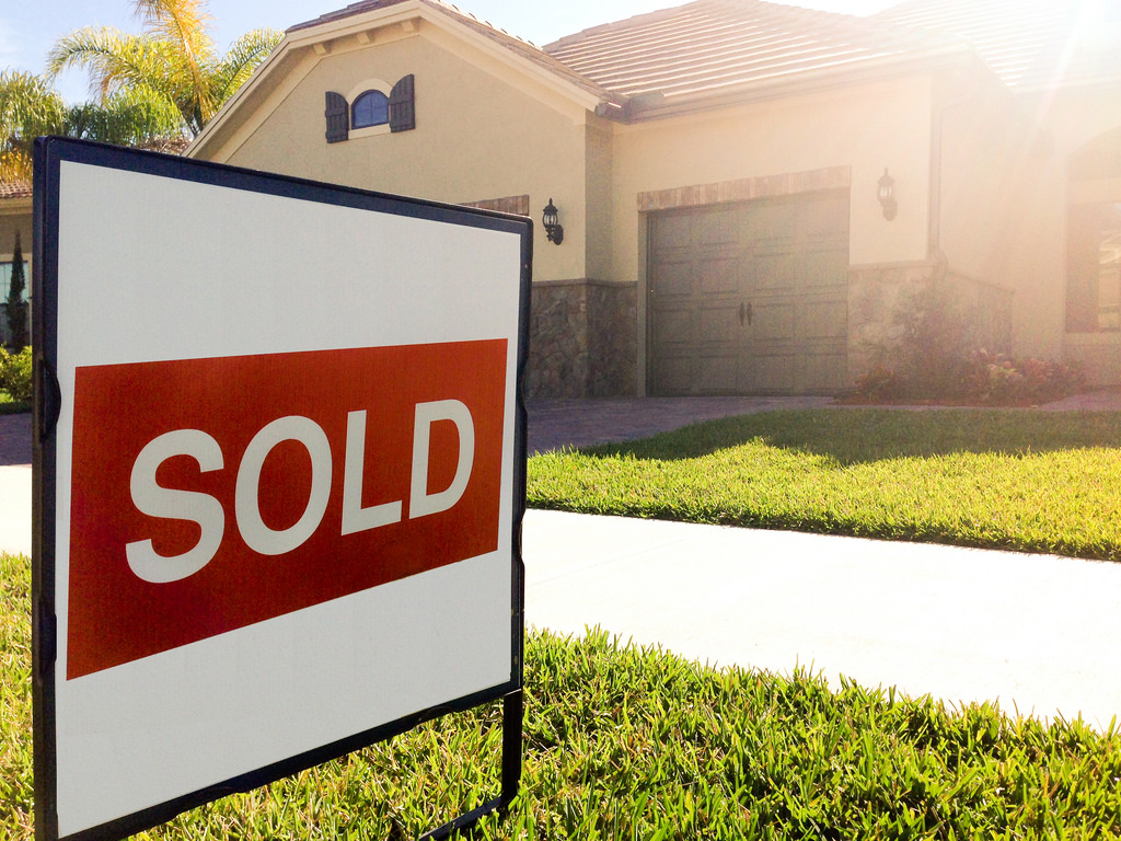 Sold sign in front of a Calgary home in a prestige Calgary neighbourhood