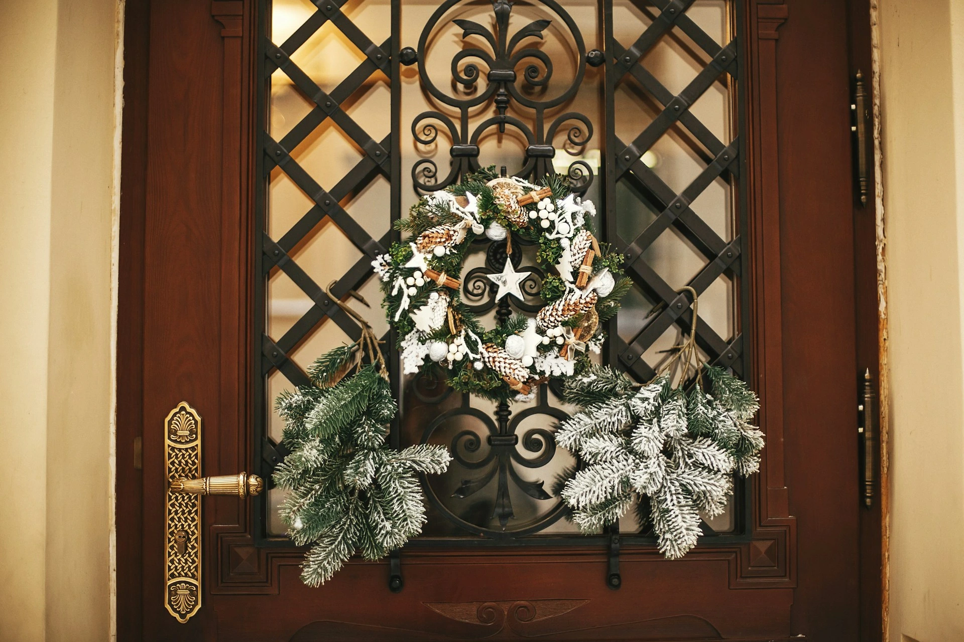 Front door decorated with a winter wreath and greenery, demonstrating curb appeal tips for selling a Calgary home in winter.