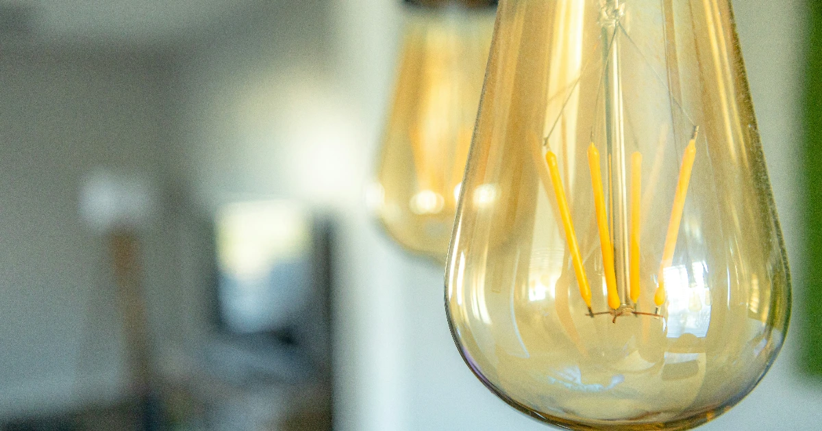 Glowing LED light bulb highlighting energy-efficient upgrades for Calgary homeowners.