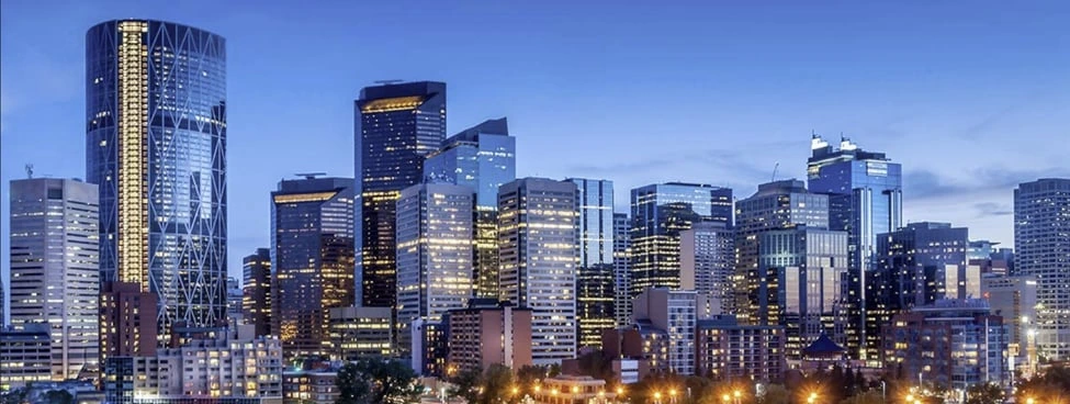 Calgary downtown skyline at dusk, symbolizing shifts in the city’s real estate market and housing trends.